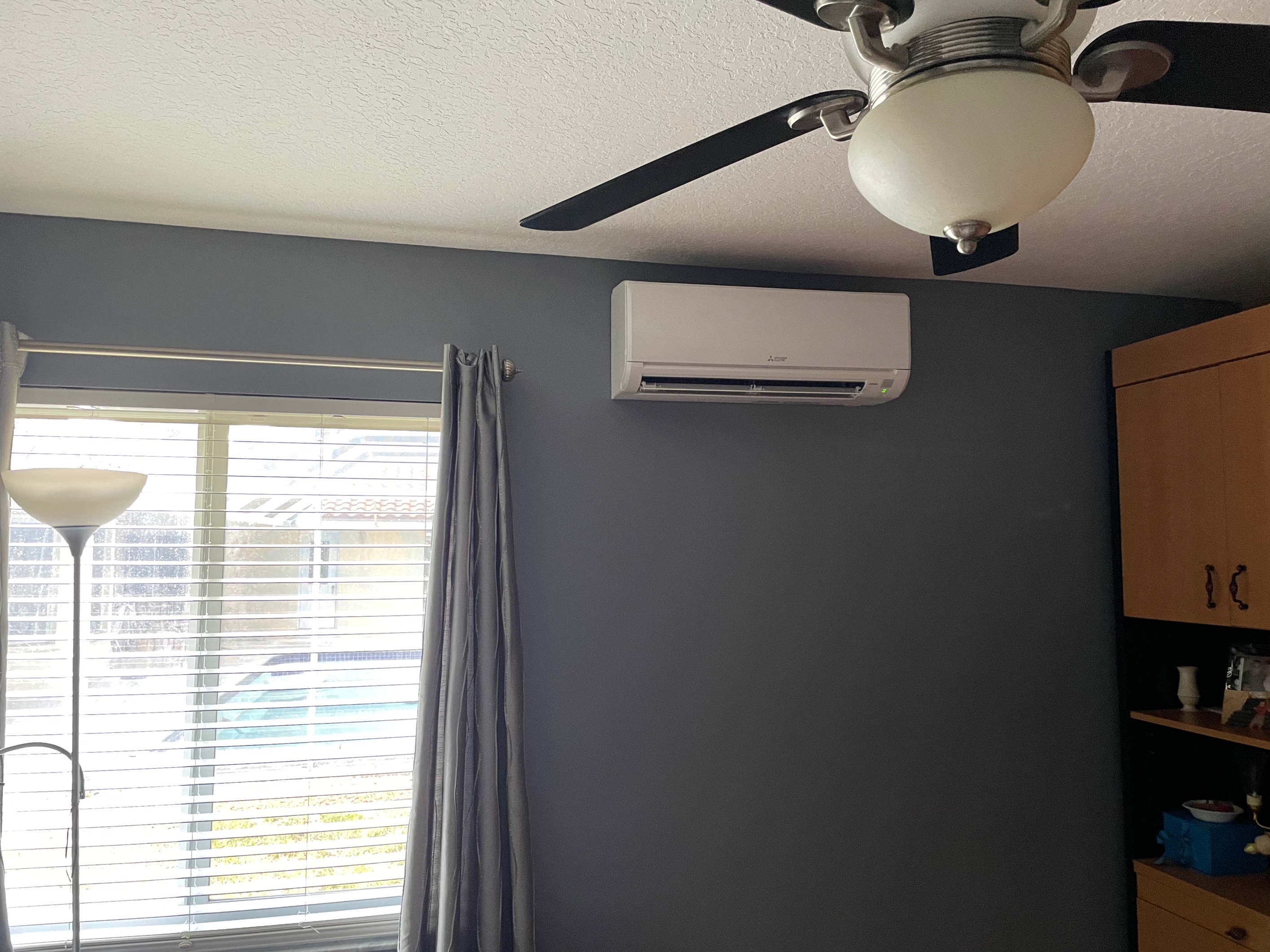 bedroom with AC unit after AC services Coral Springs