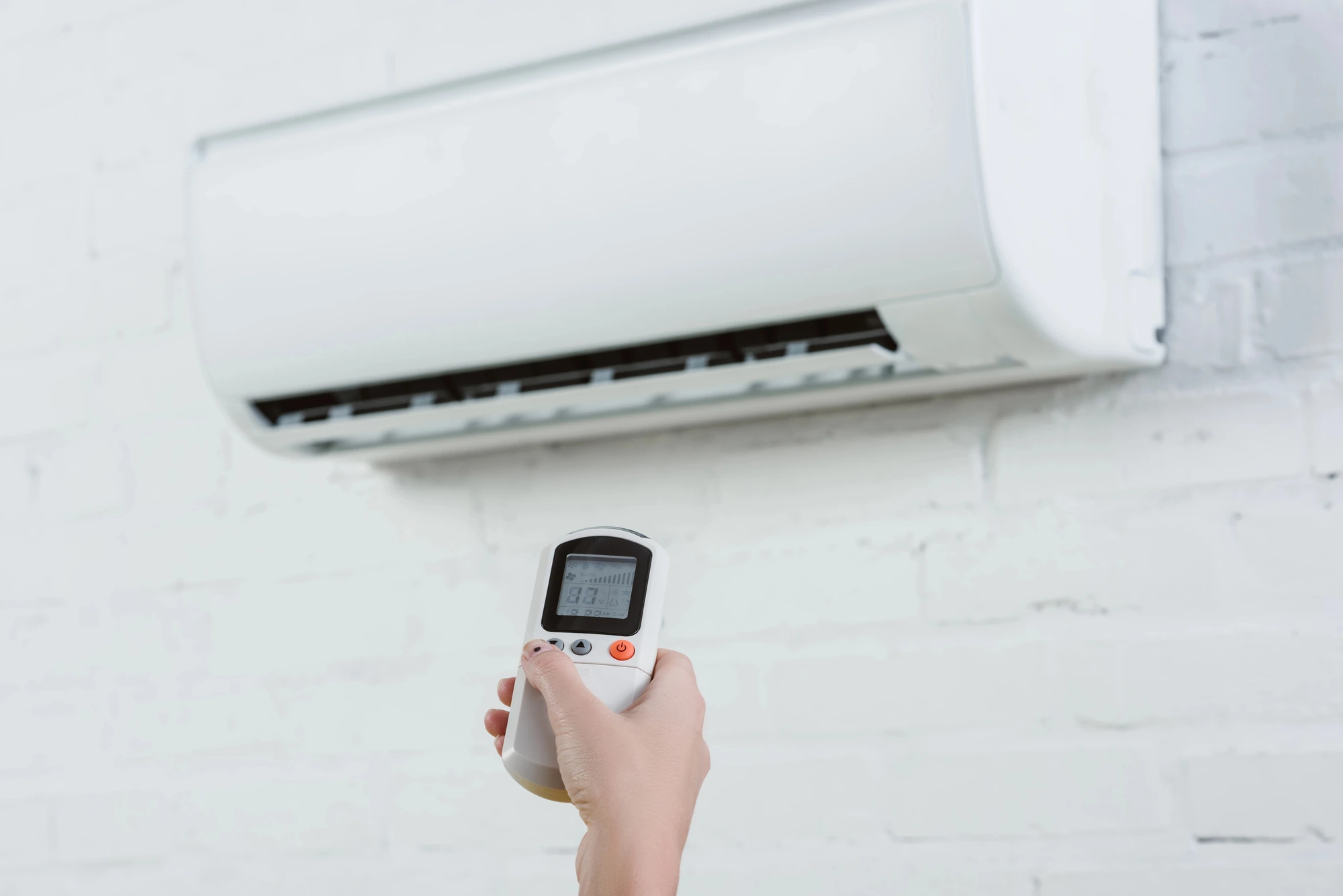 person turning ac on after ac service coral springs