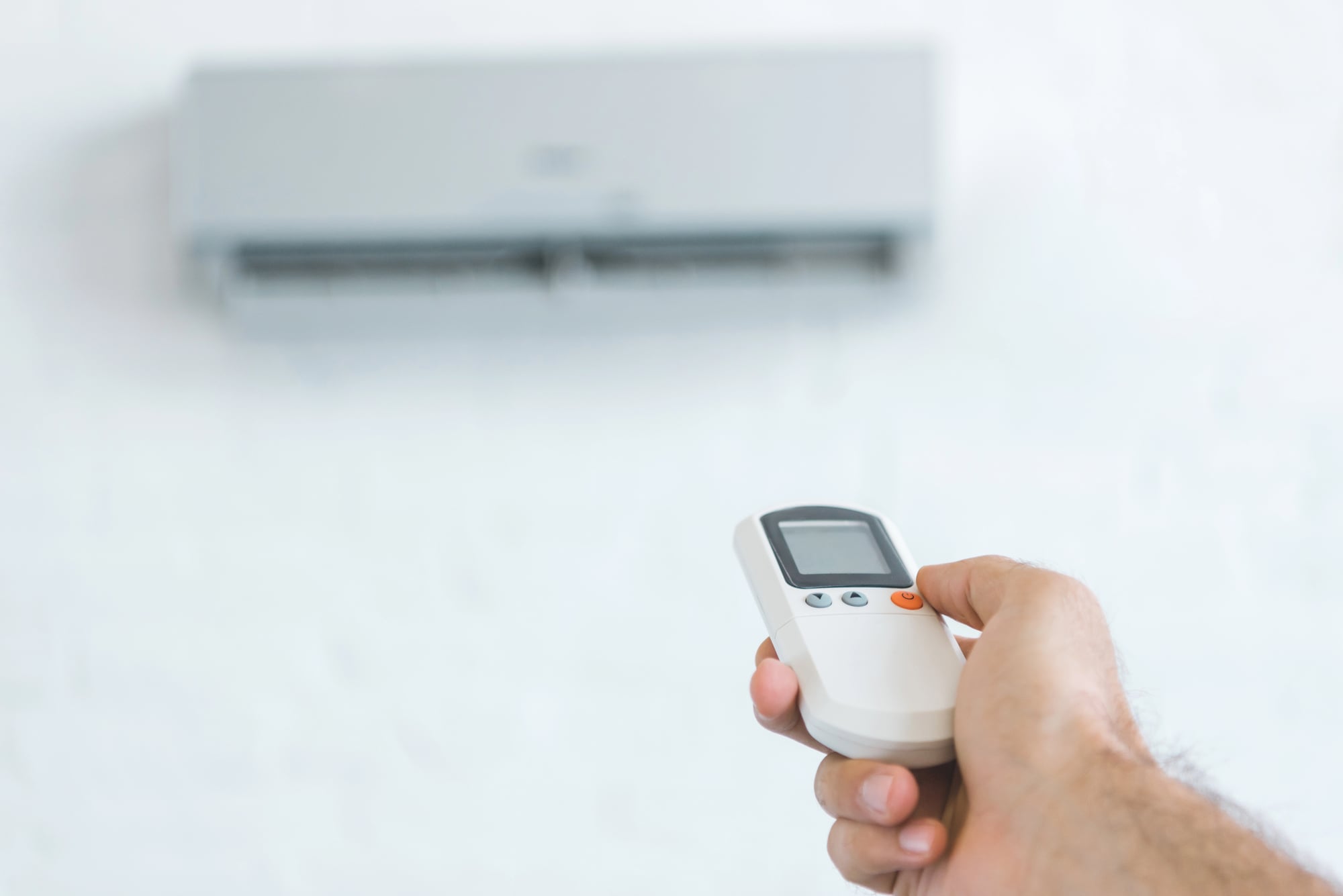 person turning on AC in Coral Springs