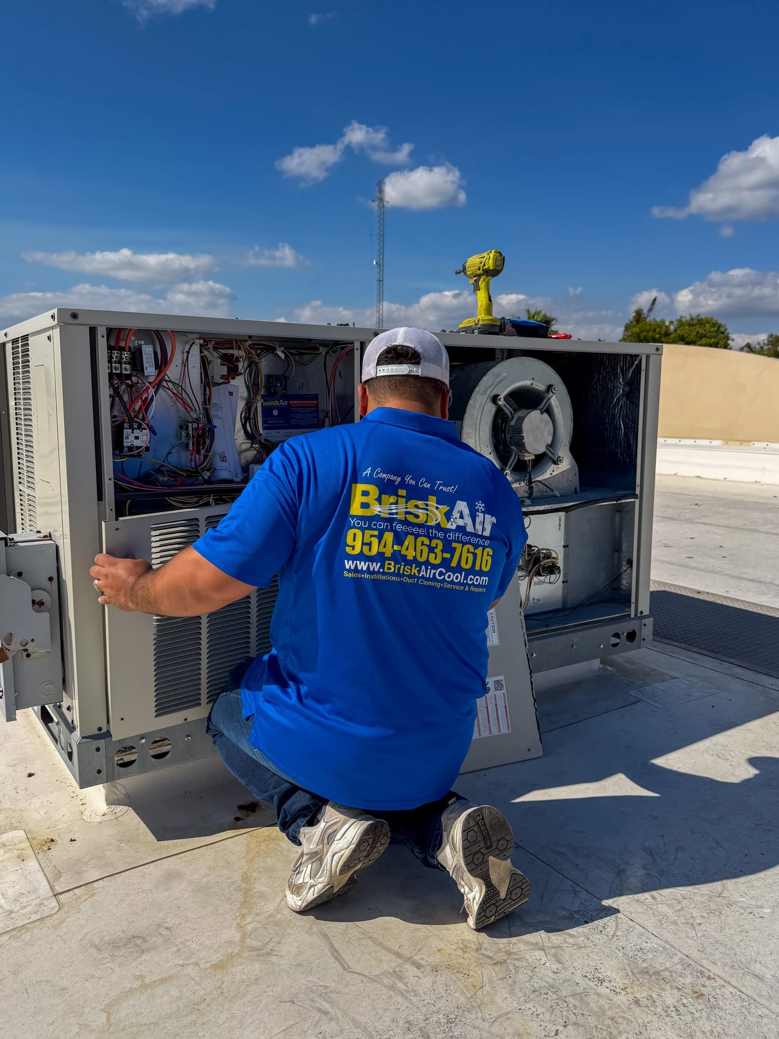 technician doing commercial air conditioner repair Coral Springs FL